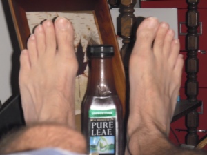 From left to right: My good foot, formerly my bad foot until this morning; the world's worst iced tea; my new "bad" foot, already feeling better thanks to the healing powers of pulled pork barbeque.